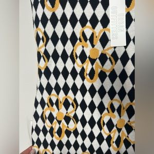 Printed midi dress from UP. Bodycon fit. Complete with a cutout back.